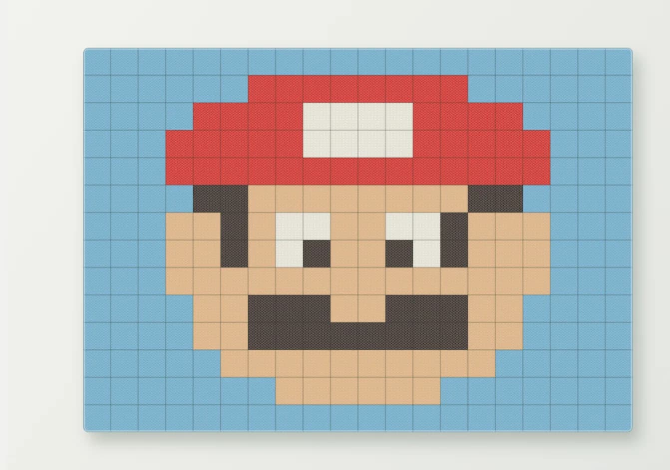 A knitted preview of the Mario pattern in Jennys teppe